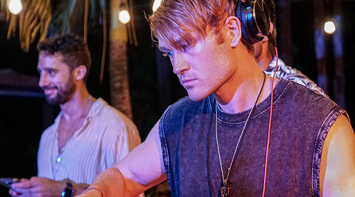 Sam Mailloux wearing headphones DJing In Tulum