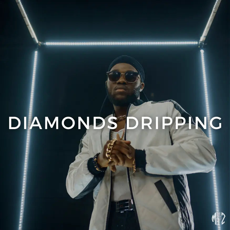 Diamonds Dripping – Hip-Hop/Trap Beat by Mayu Beatz (142 BPM, A Minor). Person wearing sunglasses and white jacket with 'Diamonds Dripping' text in a dark setting. Royalty-free for recording artists.
